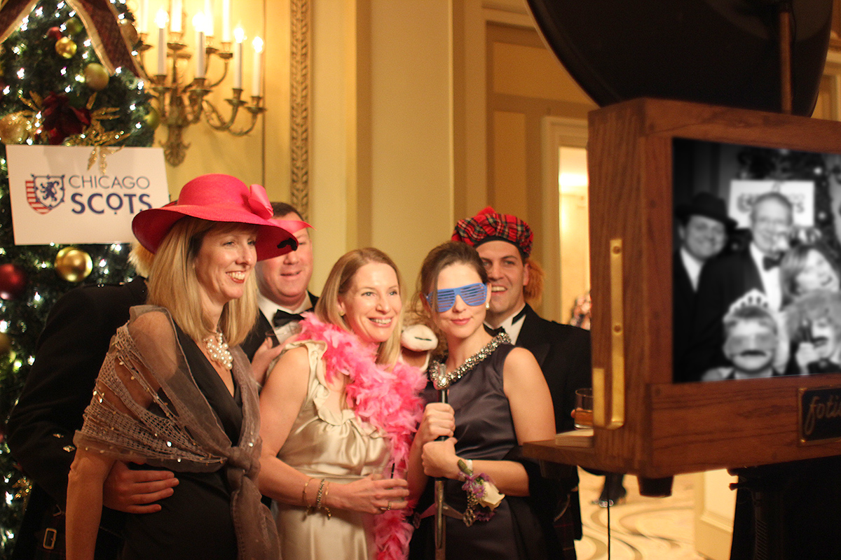 Guests pose for a photo booth picture at the Palmer House!