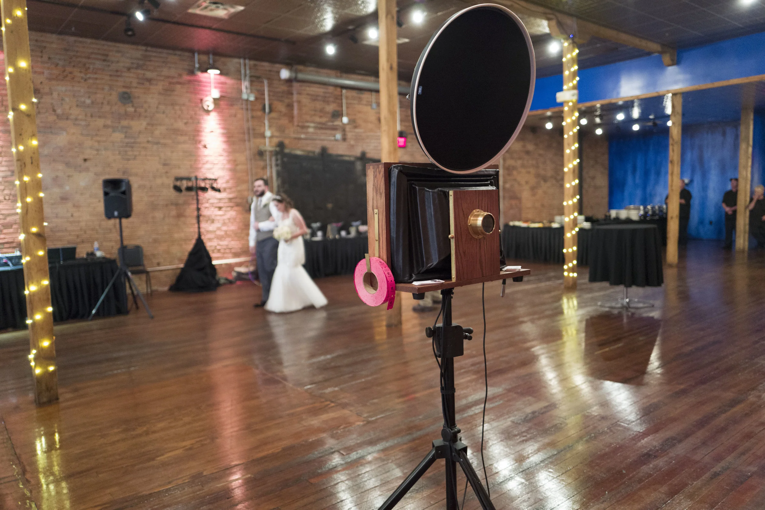The bride and groom make their entrance in the Distillery Room at The Waterhouse.
