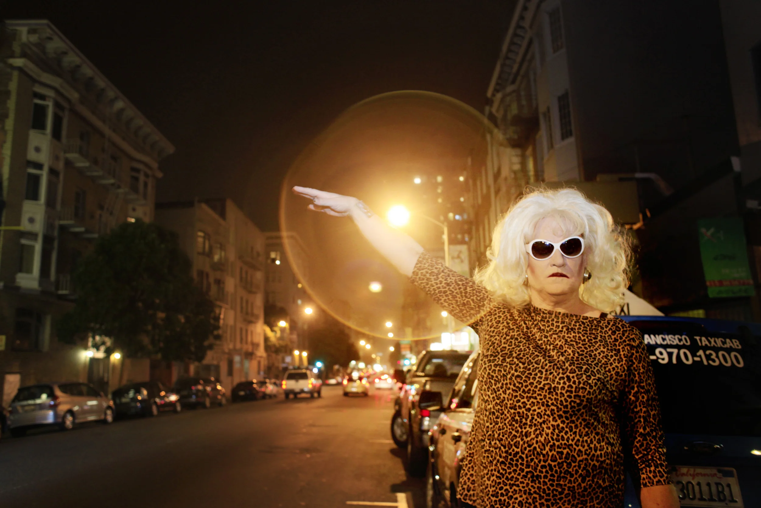  Collette LeGrand-Ashton hails a cab &nbsp;bound for the Dream Queens Revue at Aunt Charlie's where she has been running a weekly drag for 8 years in San Francisco, California.&nbsp; 