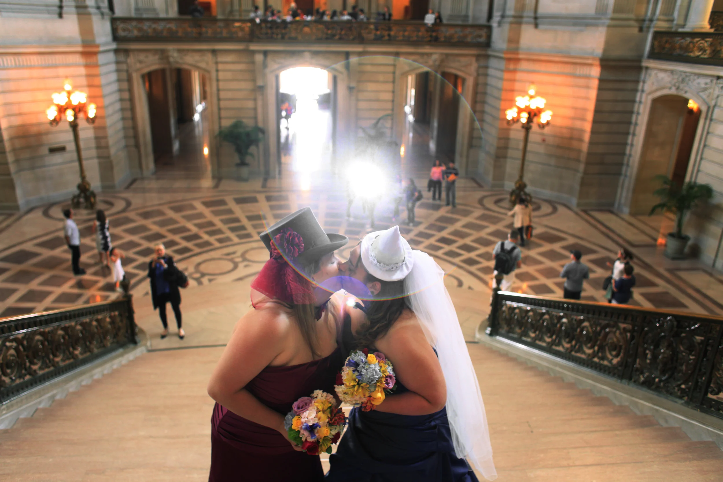  Days after proposition 8 was declared unconstitutional, Anna Hennigh, 27, and Melody Hennigh, 26, kiss at the top of the grand staircase under the rotunda before getting married at San Francisco City Hall. 