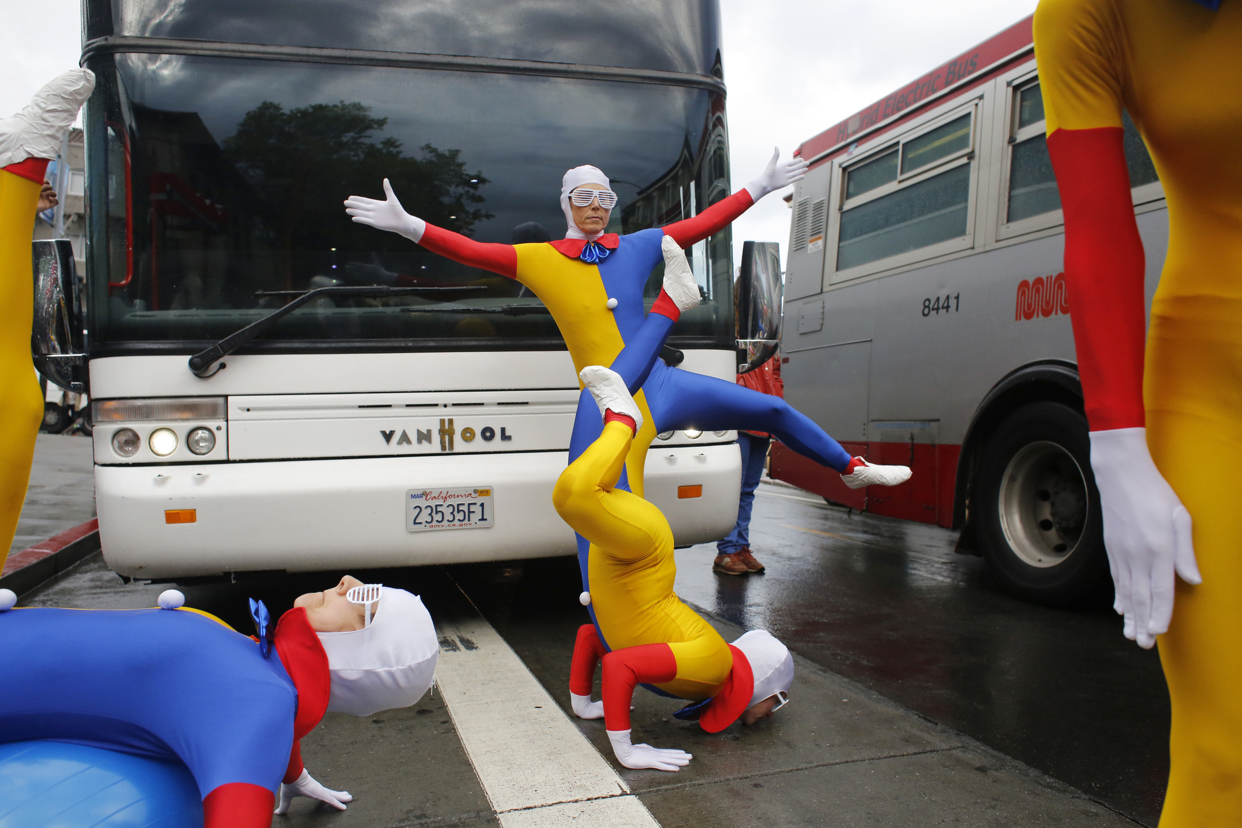  A group of protesters calling themselves the "Gmuni dancers" block a Google Bus from moving down 24th Street at Valencia Street in San Francisco, Calif. 