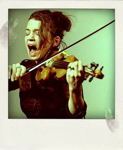 Magik*Magik works closely with CARLA KIHLSTEDT to add string arrangements for a show with her band 2 FOOT YARD at the Swedish American Hall in 2008.