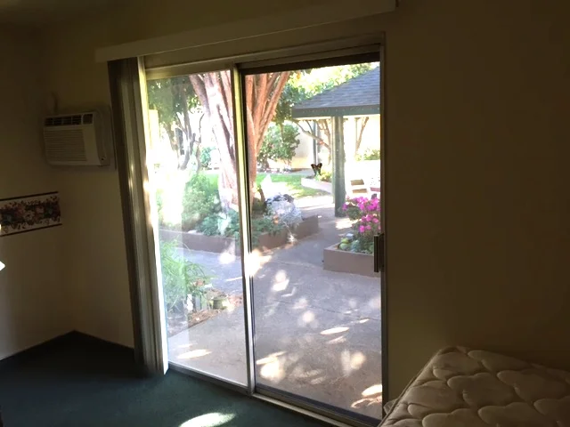 Patio door opens to beautiful courtyard