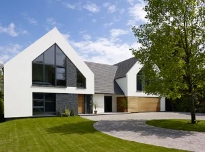 The Client’s brief for this project was to take design direction from a nearby project shown above. This is reflected in the design by the use of a twin gable form. Alternative architectural details were adopted to lower the cost and create a more maintenance friendly finish. The internal design was significantly different to reflect the Client’s personal requirements and to fit with the existing structure.