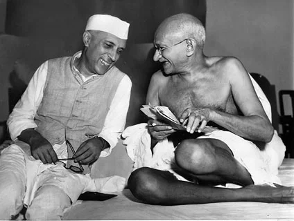 Here Gandhi is sharing some laughter with fellow independence movement leader Jawharlal Nehru, Mumbai, 1946