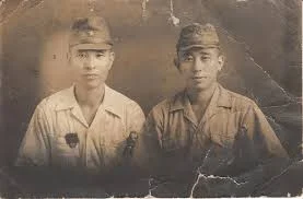 An actual photo of two young Japanese soldiers.