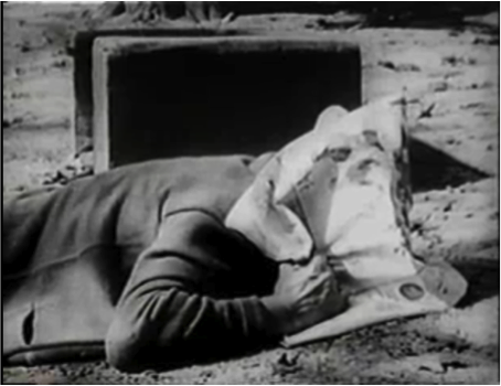 The father using a newspaper as protection.
