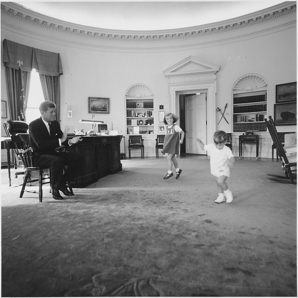 Kennedy with his children in the oval office.