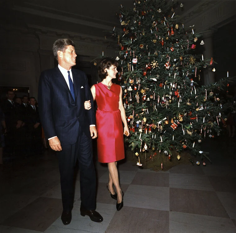 President John F. Kennedy and his wife Jackie at the White House in December 1962. Many of the Christmas practices of the 1960s - and to the present day - came from the 1950s.