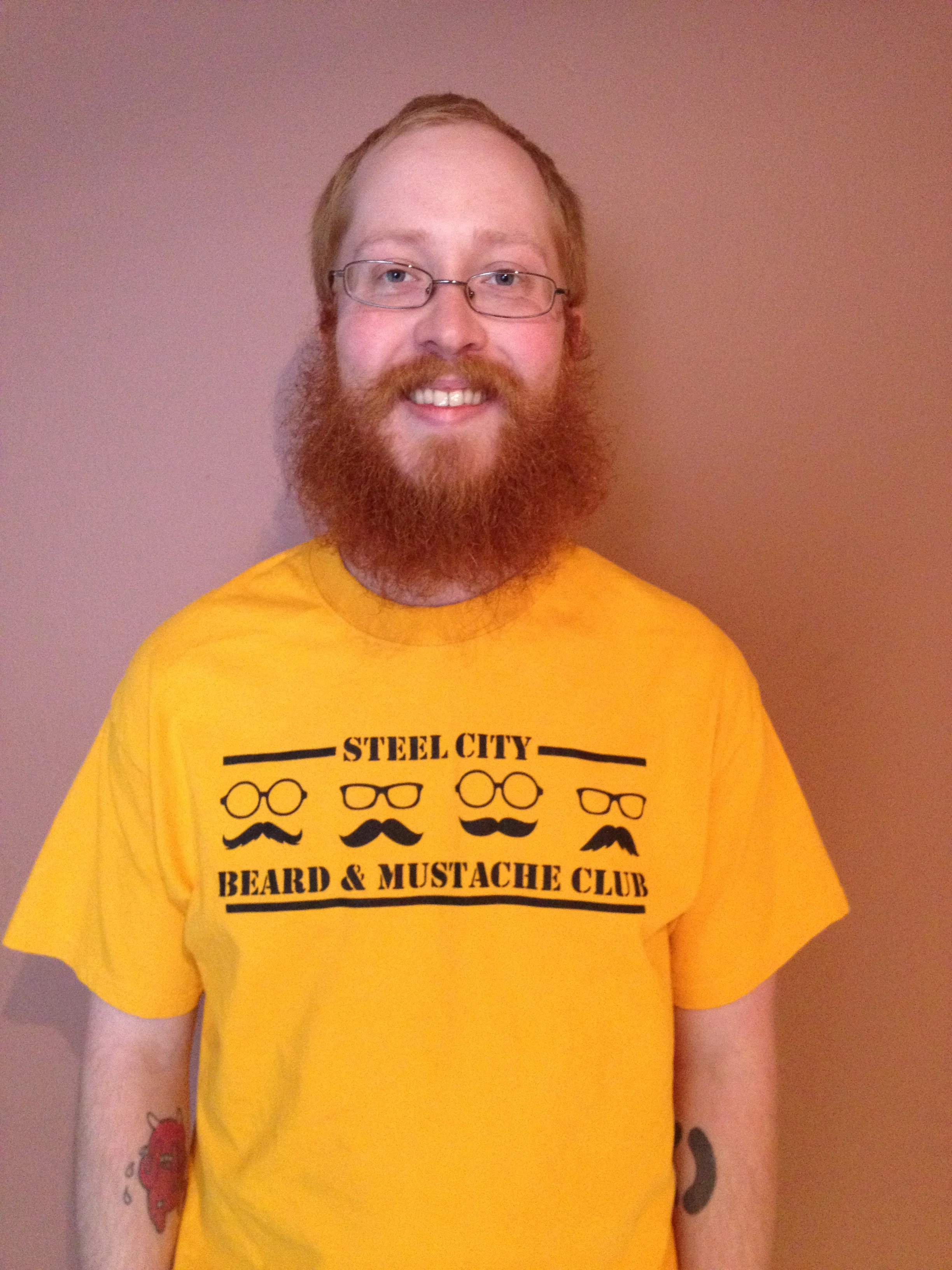 The champion displays his impressive winning beard and mustache. 