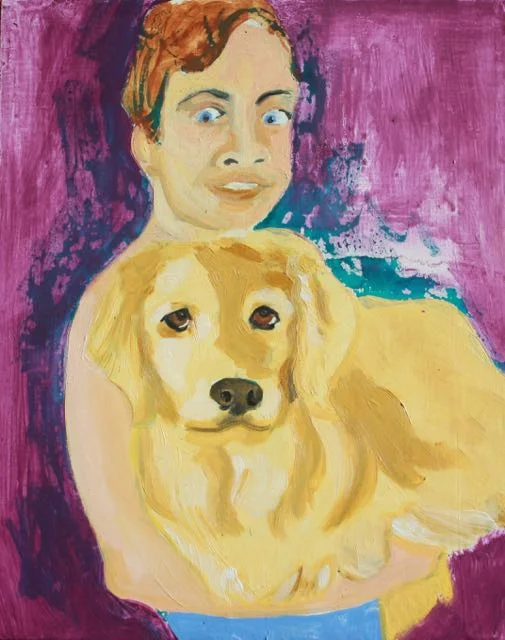Boy holds complacent dog