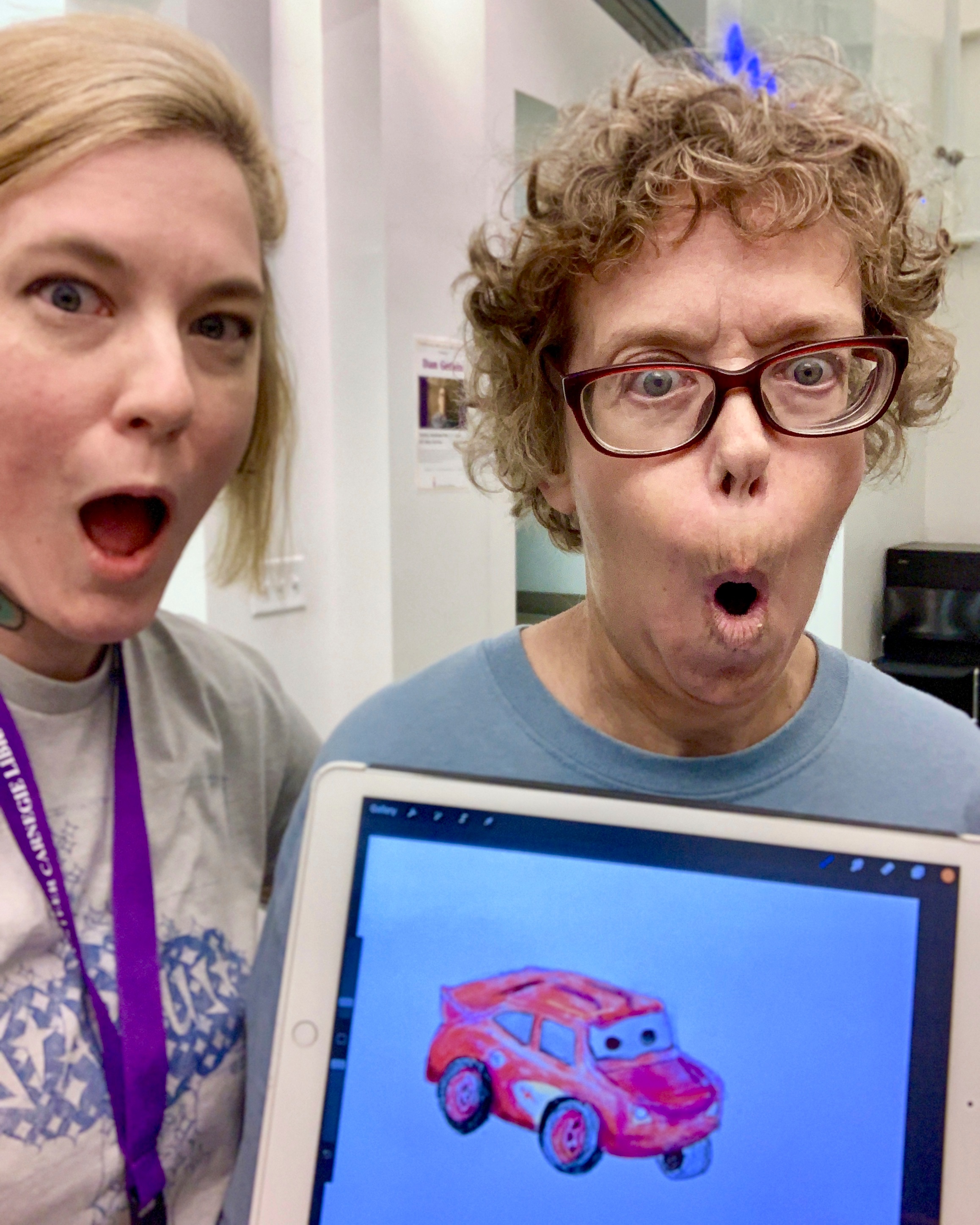 Roxanne and I holding an iPad with her first ever digital drawing <3
