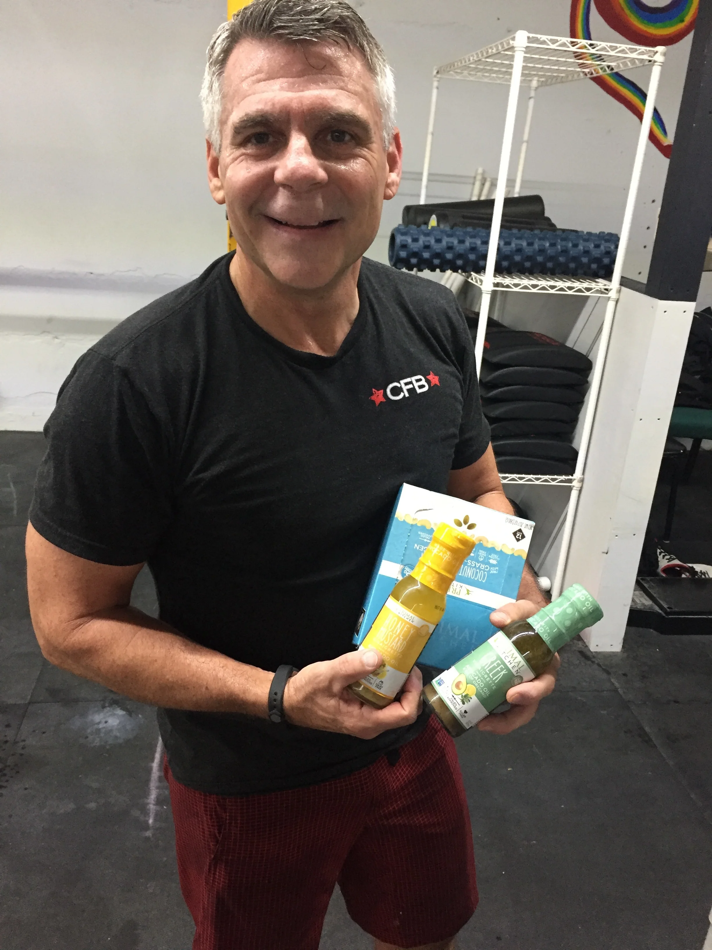 Matt Forshee accepts his Week Five prizes from Primal Kitchen. Avocado oil dressings and coconut cashew protein bars.