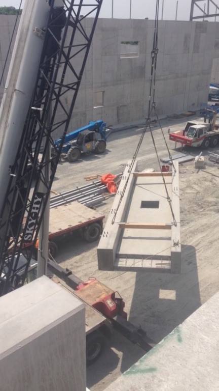 Mobile crane hoisting 60,000 lbs of precast cement