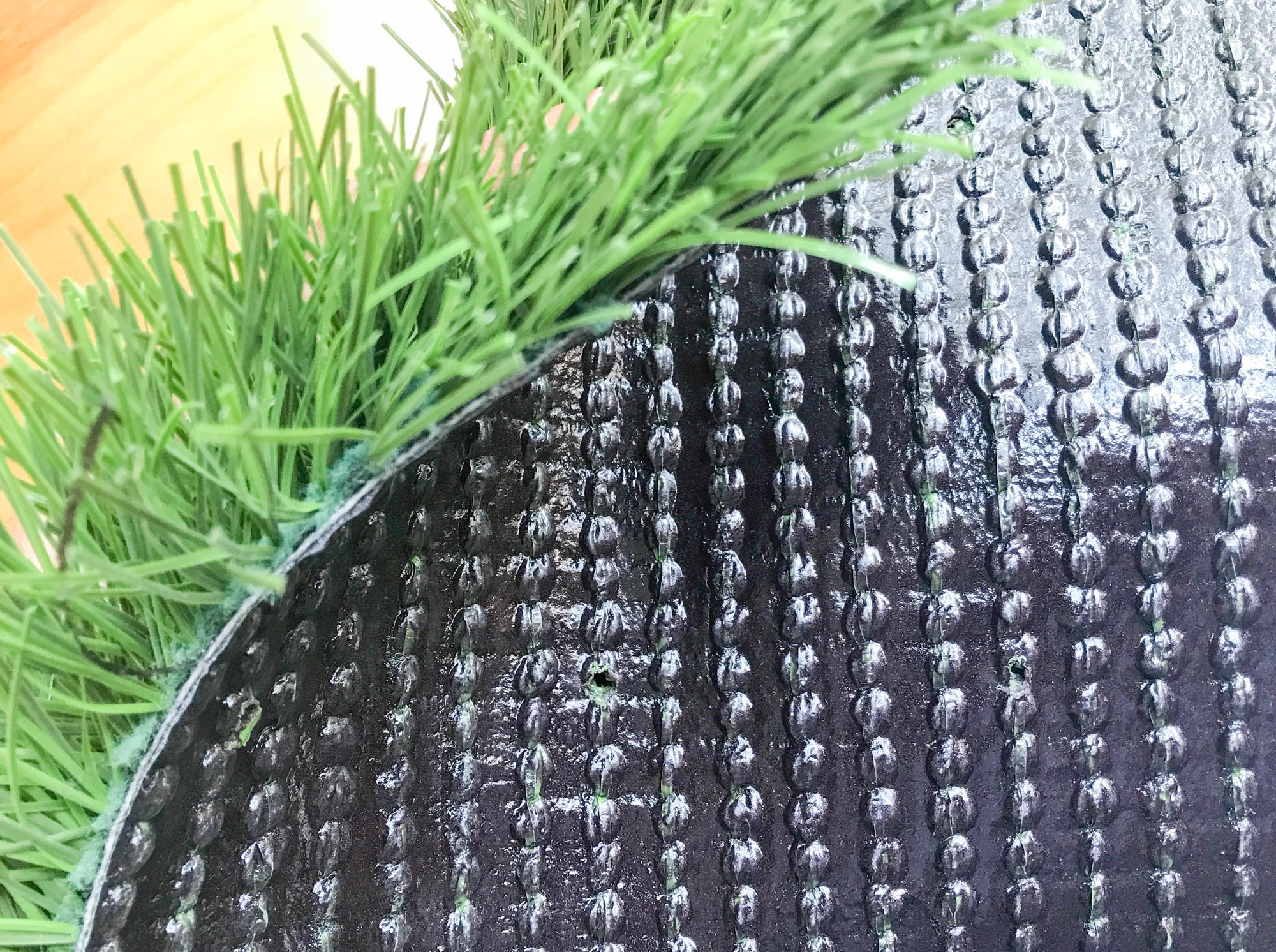 Synthetic turf fibers and backing