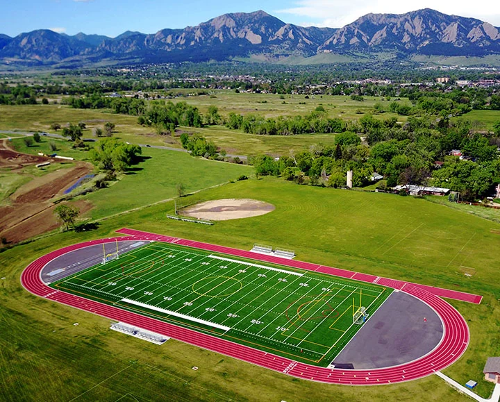 New synthetic turf field at Platt Middle School in Boulder Colorado with the flatirons in background
