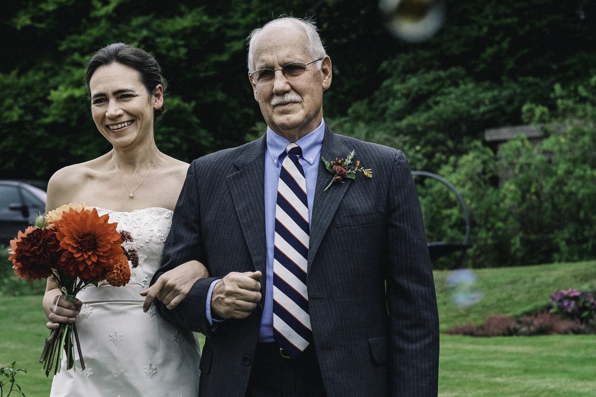 Father and daughter walking down the aisle