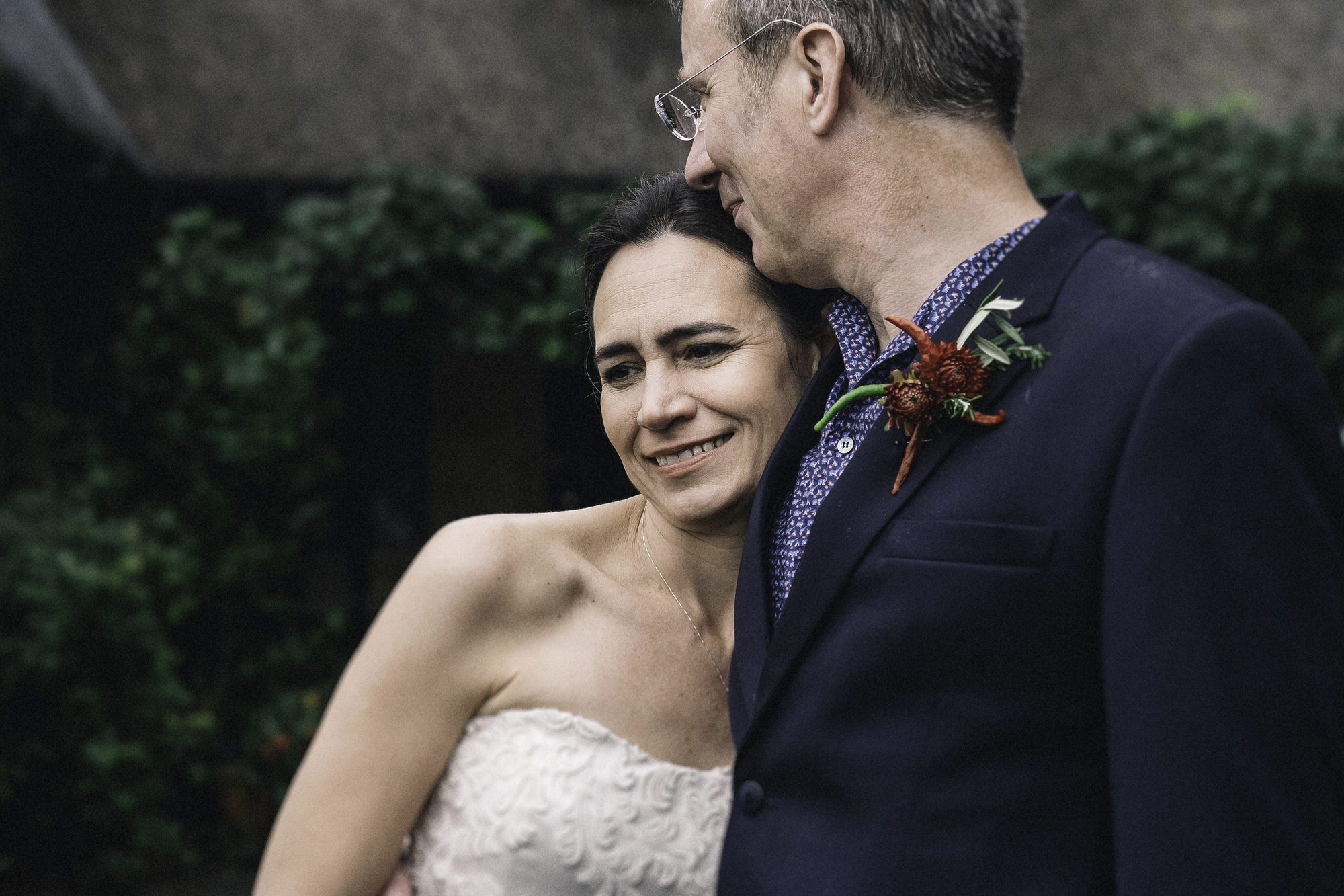 Groom kisses wife's cheek