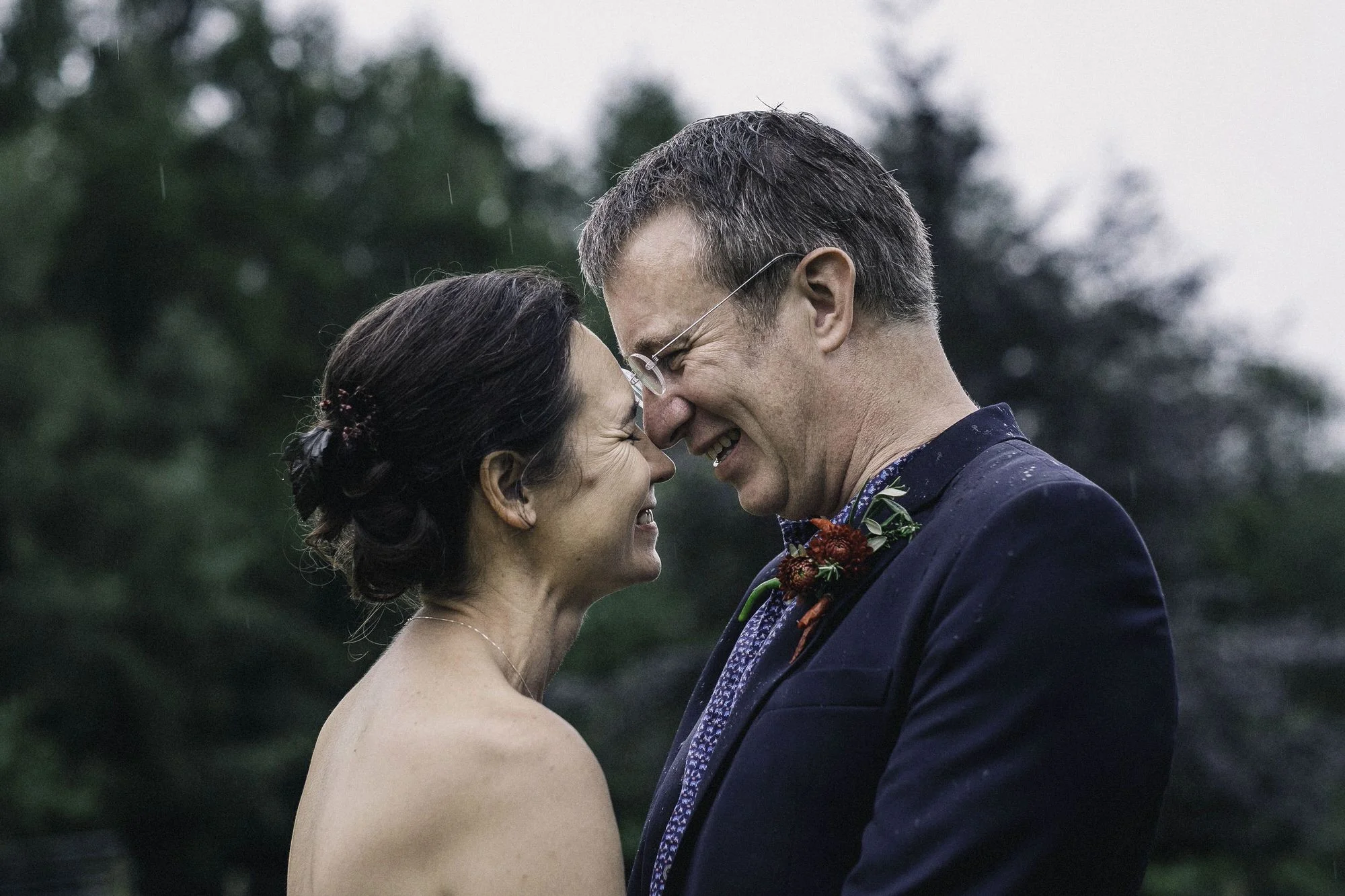 Bride + groom's foreheads together