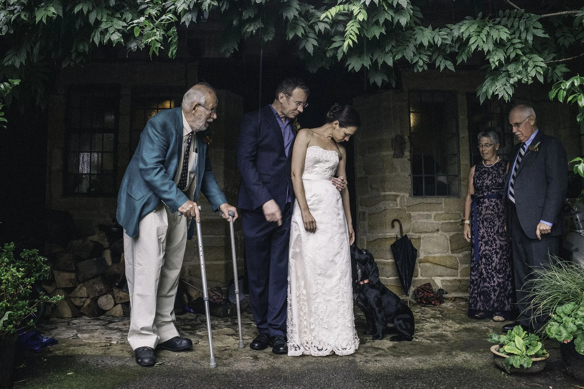 Bridal party take shelter from the rain