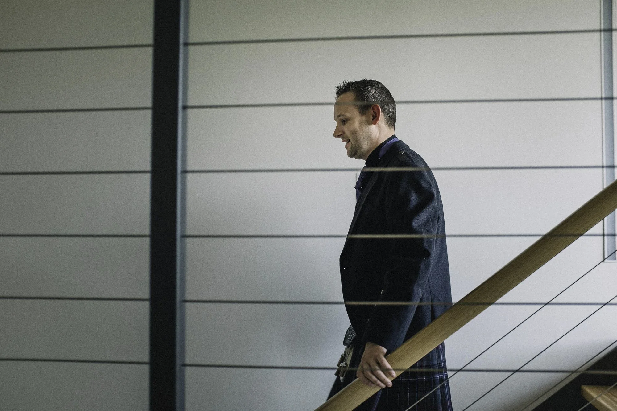 Groom walking down the stairs
