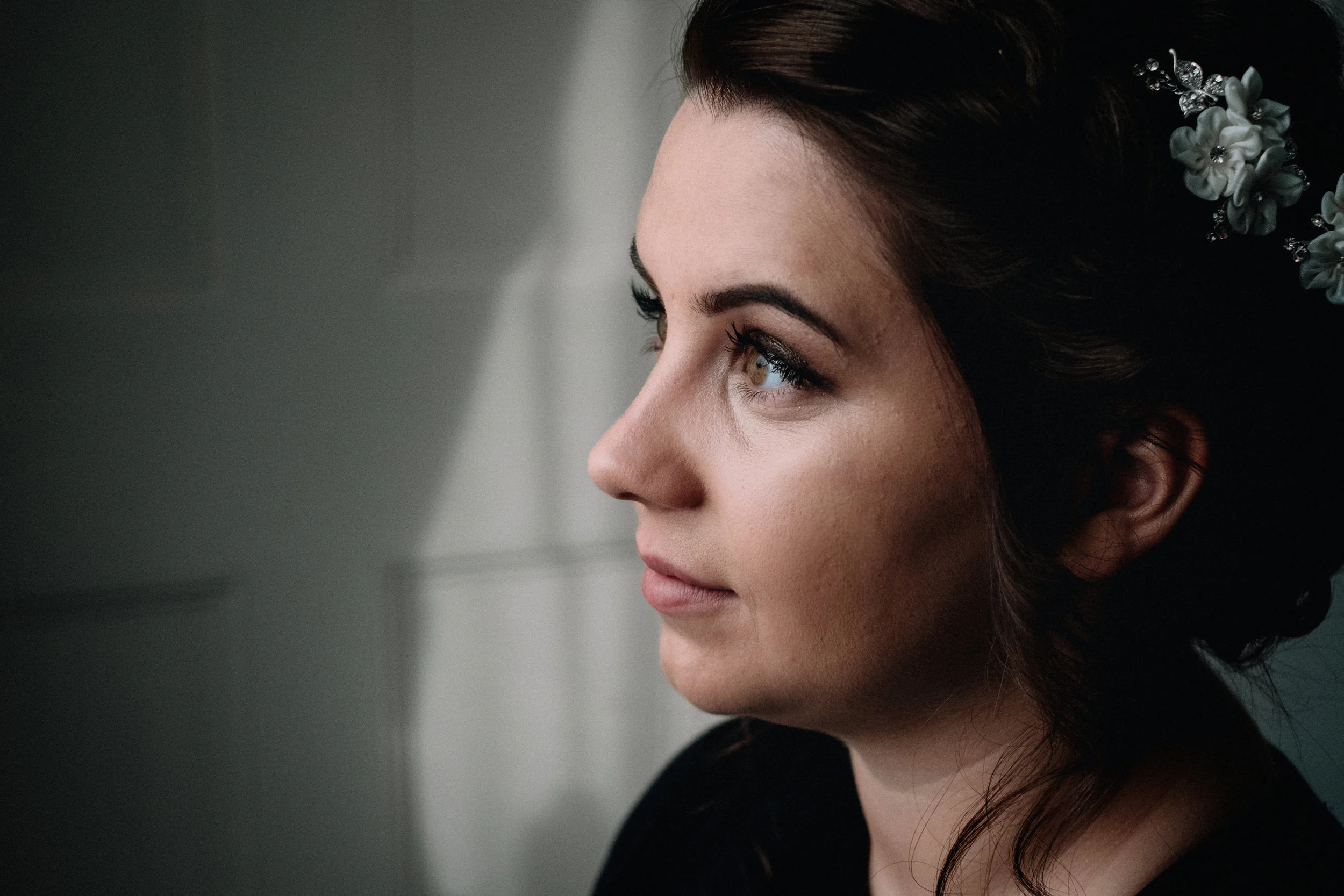 Bride looks out the mirror