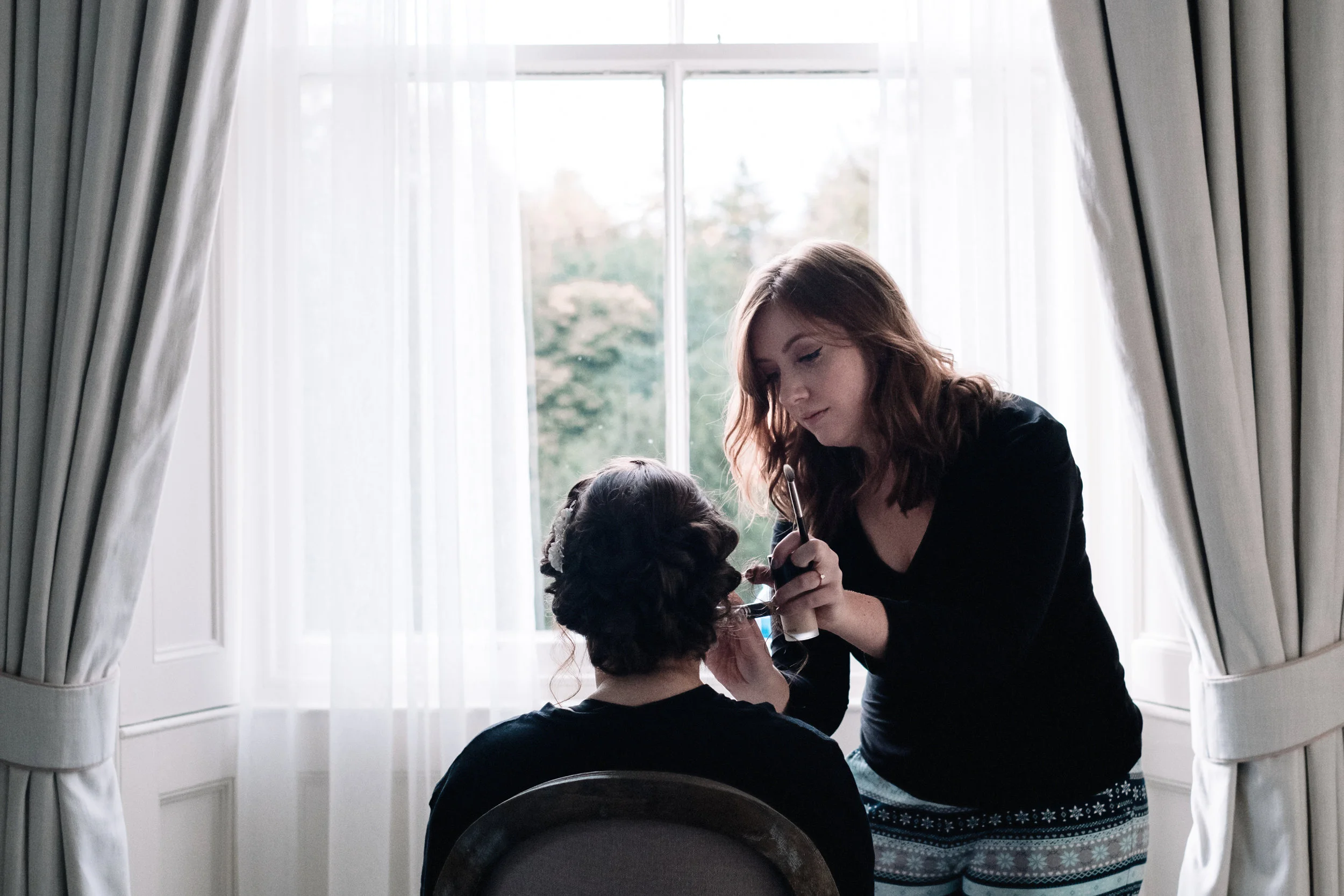 Bride getting make up applied