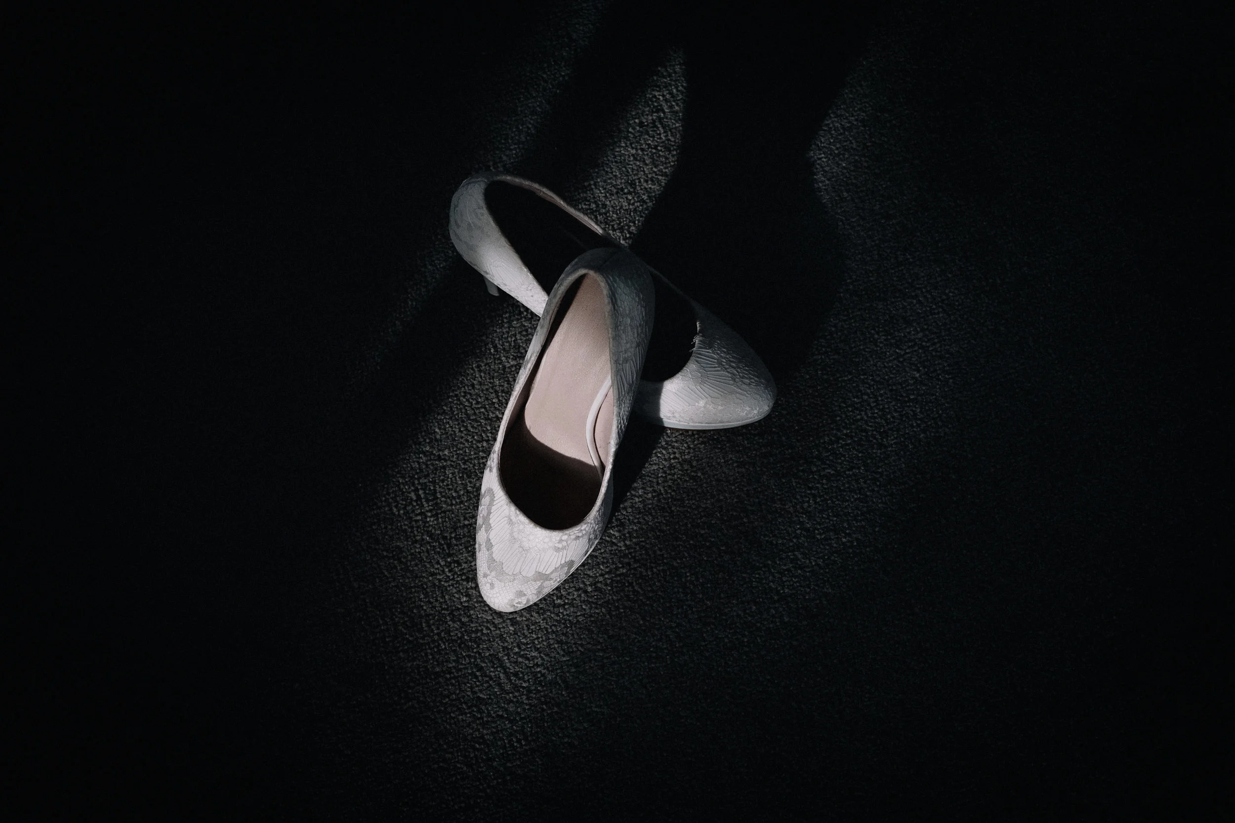 Bridal shoes in a shadows