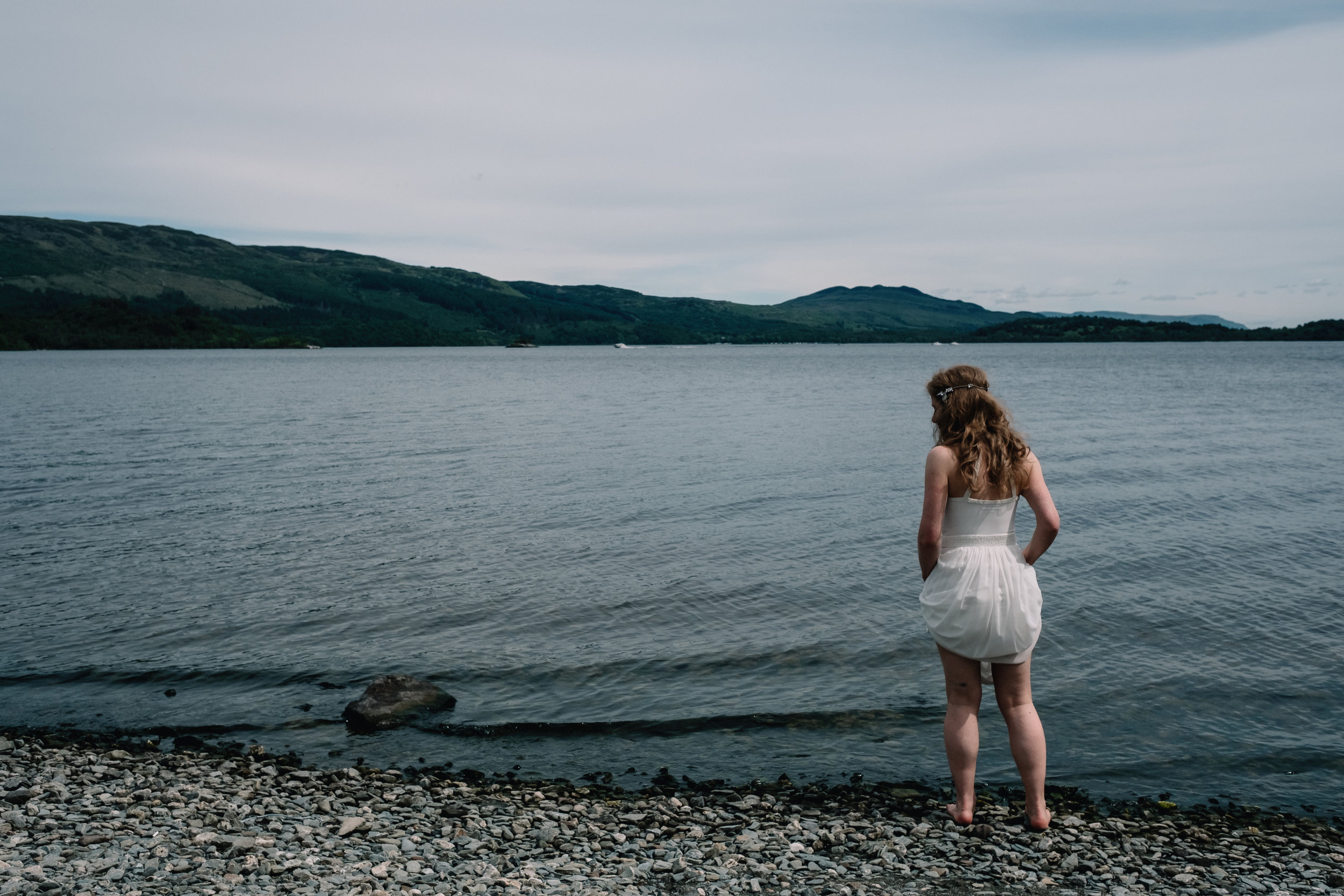Bride stands by Loch Lomond