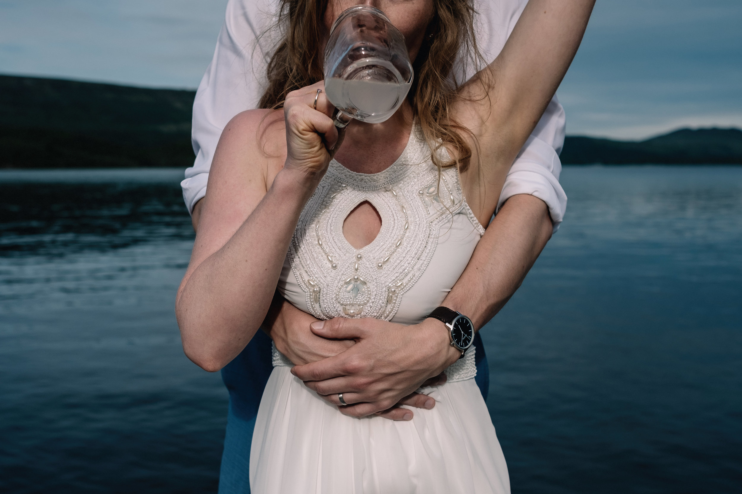 Bride drinking cocktail