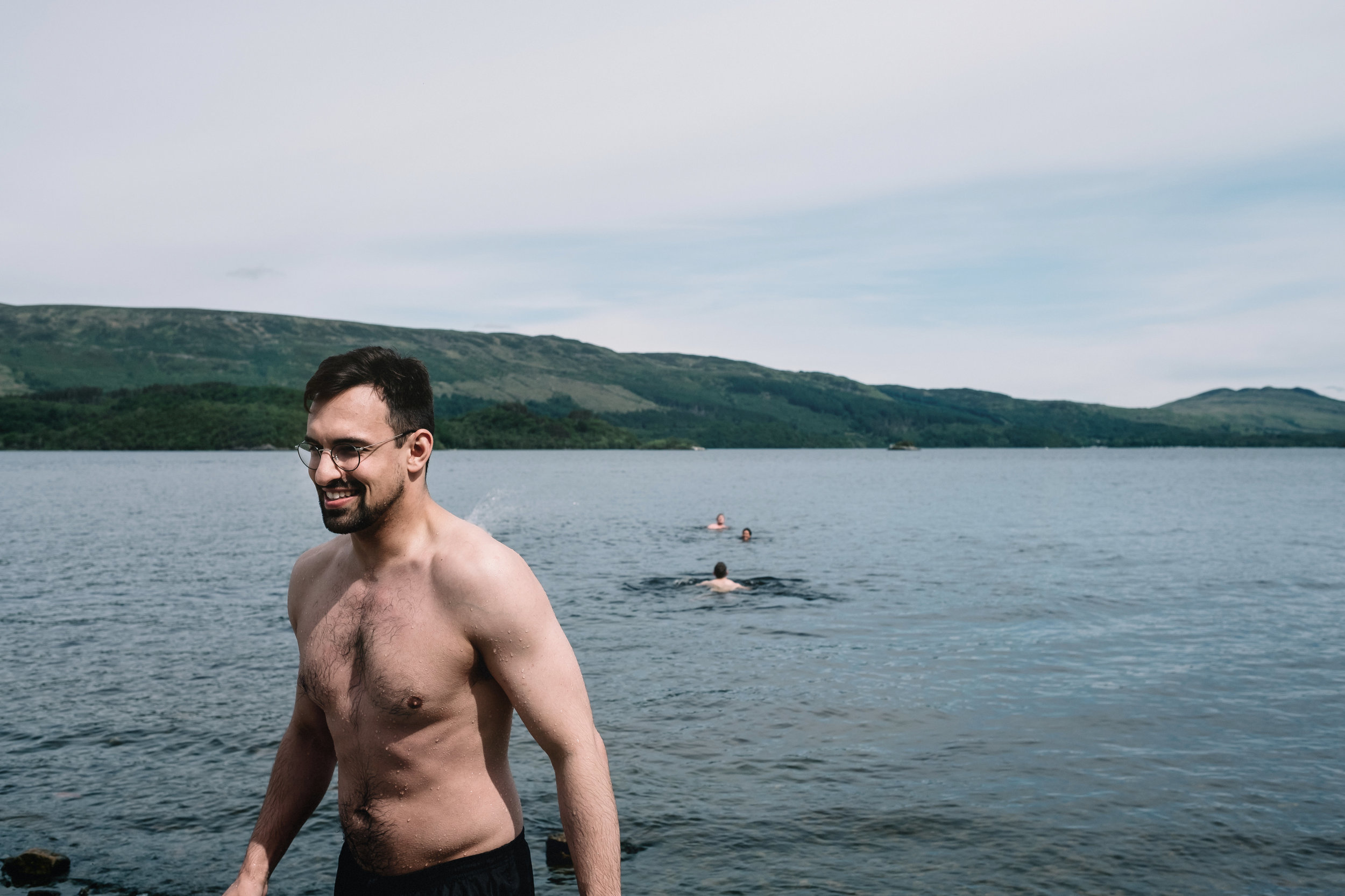 Wedding guest swimming in Loch Lomond