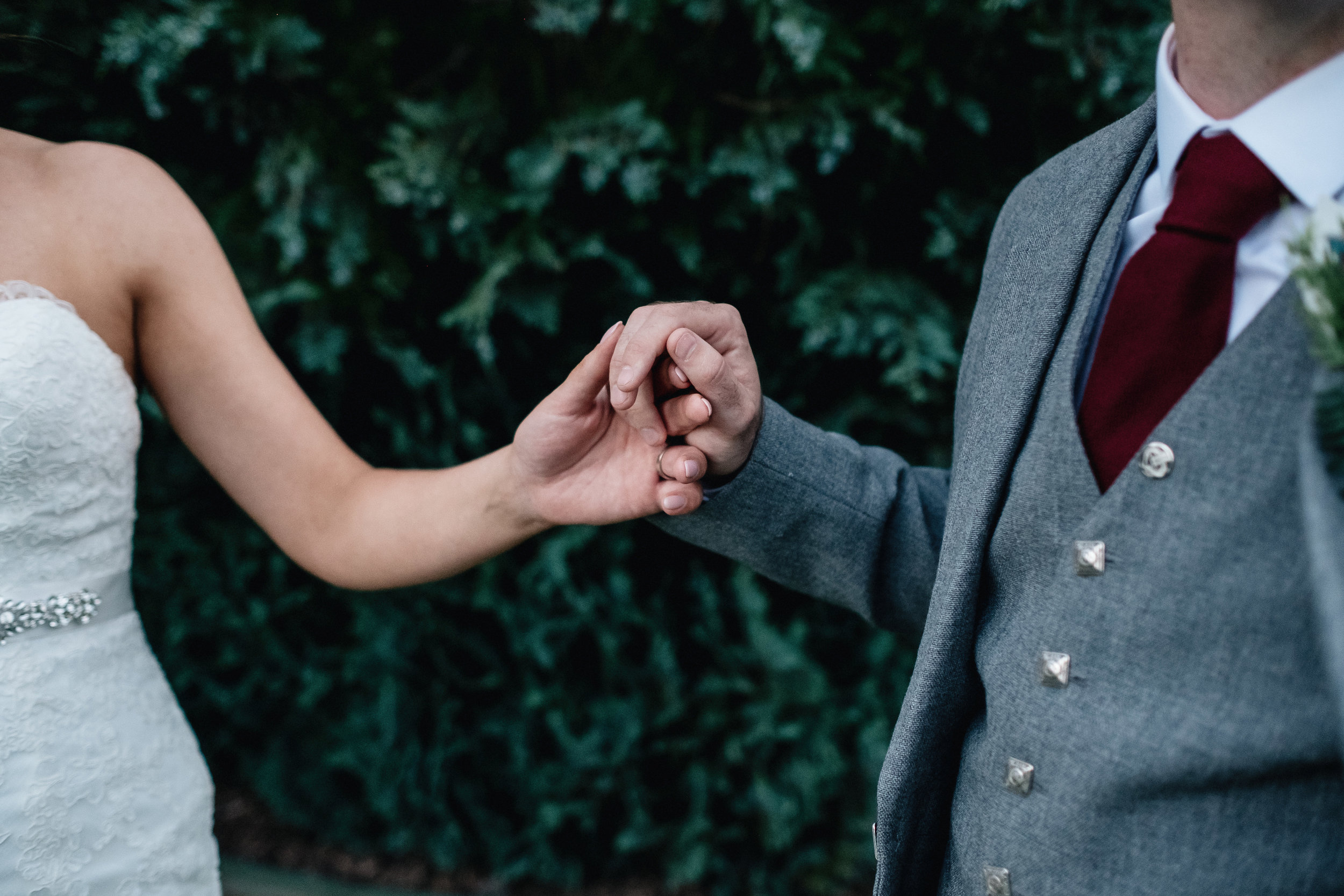 Bride and groom holding hands