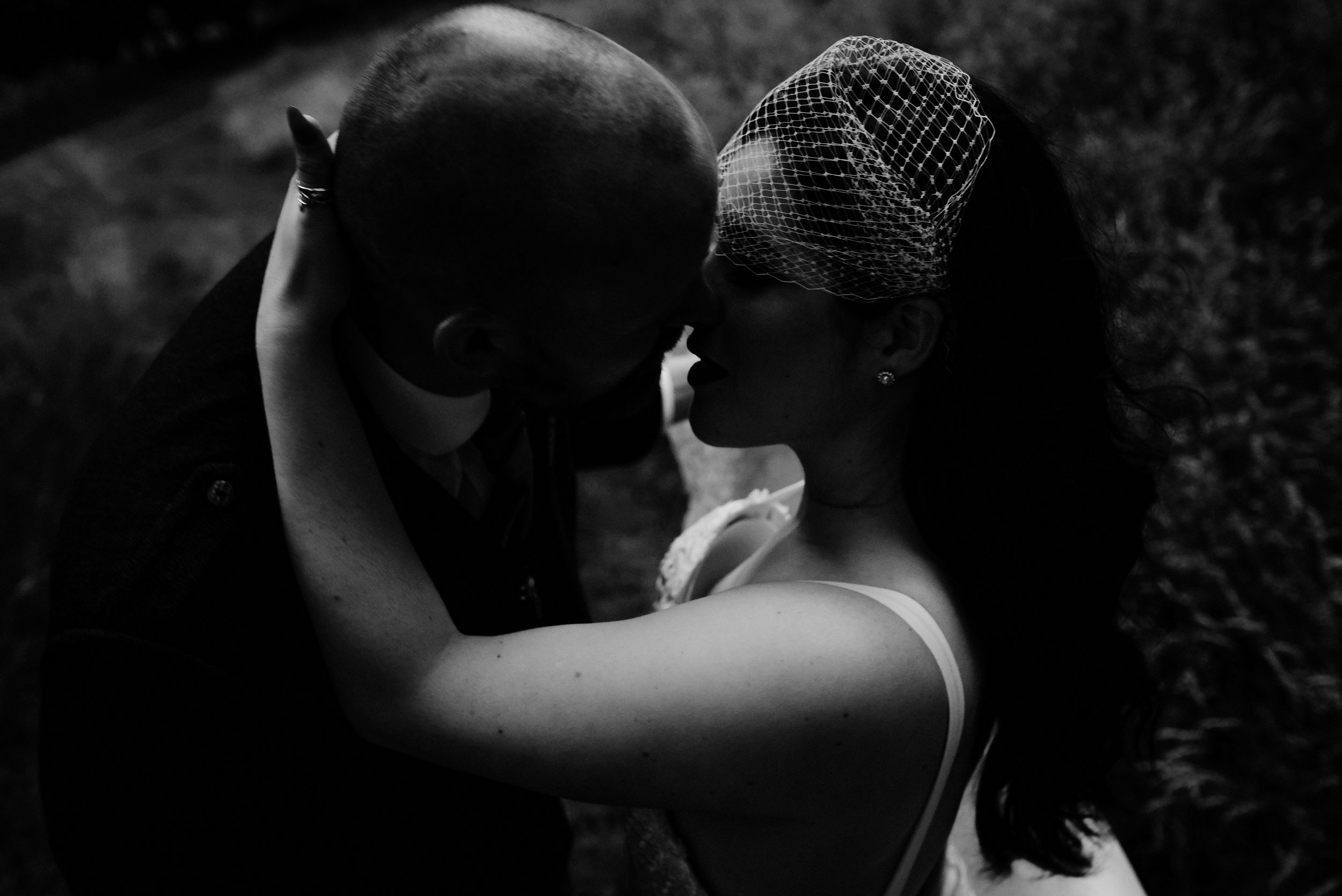 Intimate embrace between bride and groom