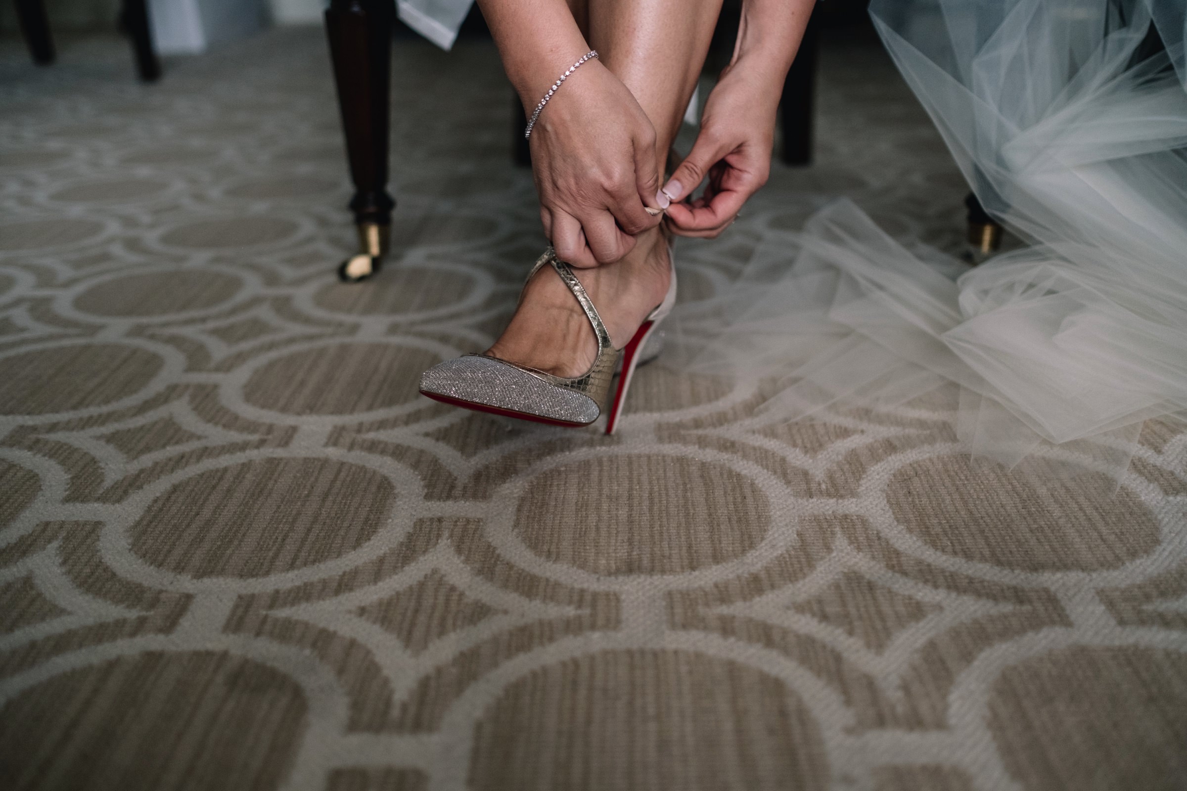 Bride putting on shoes