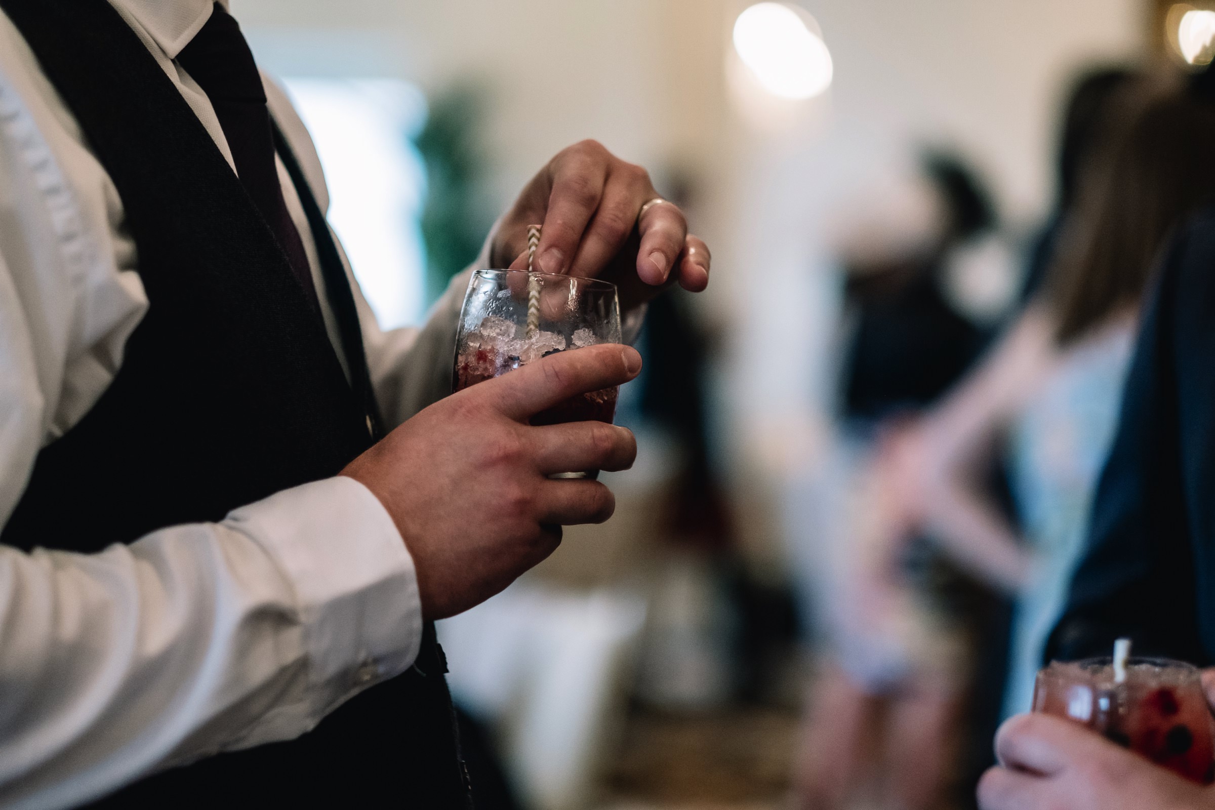 Guest holding drink