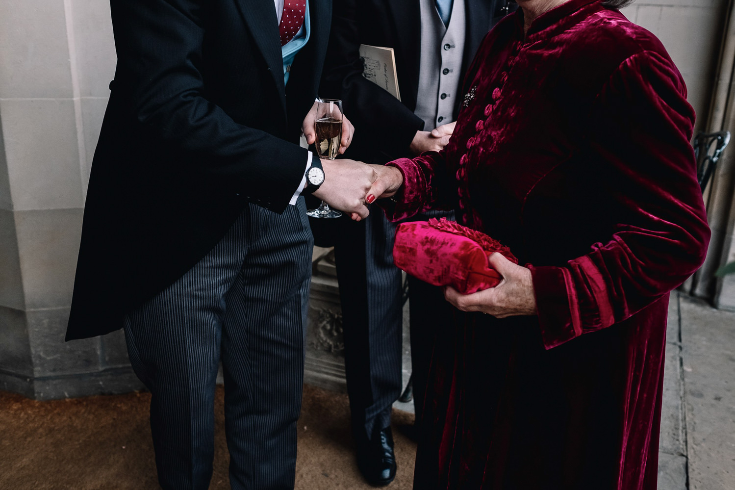  grooms shakes his mother's hand upon arrival at Dundas Castle 