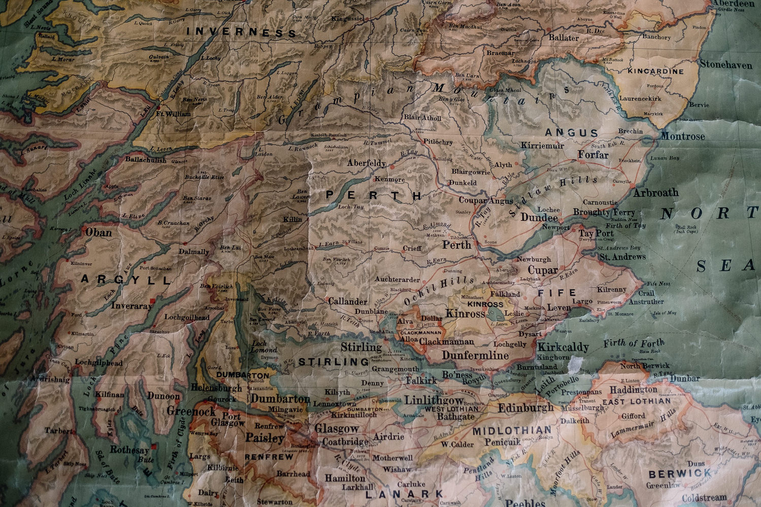 Worn map displaying Perthshire on the wall.