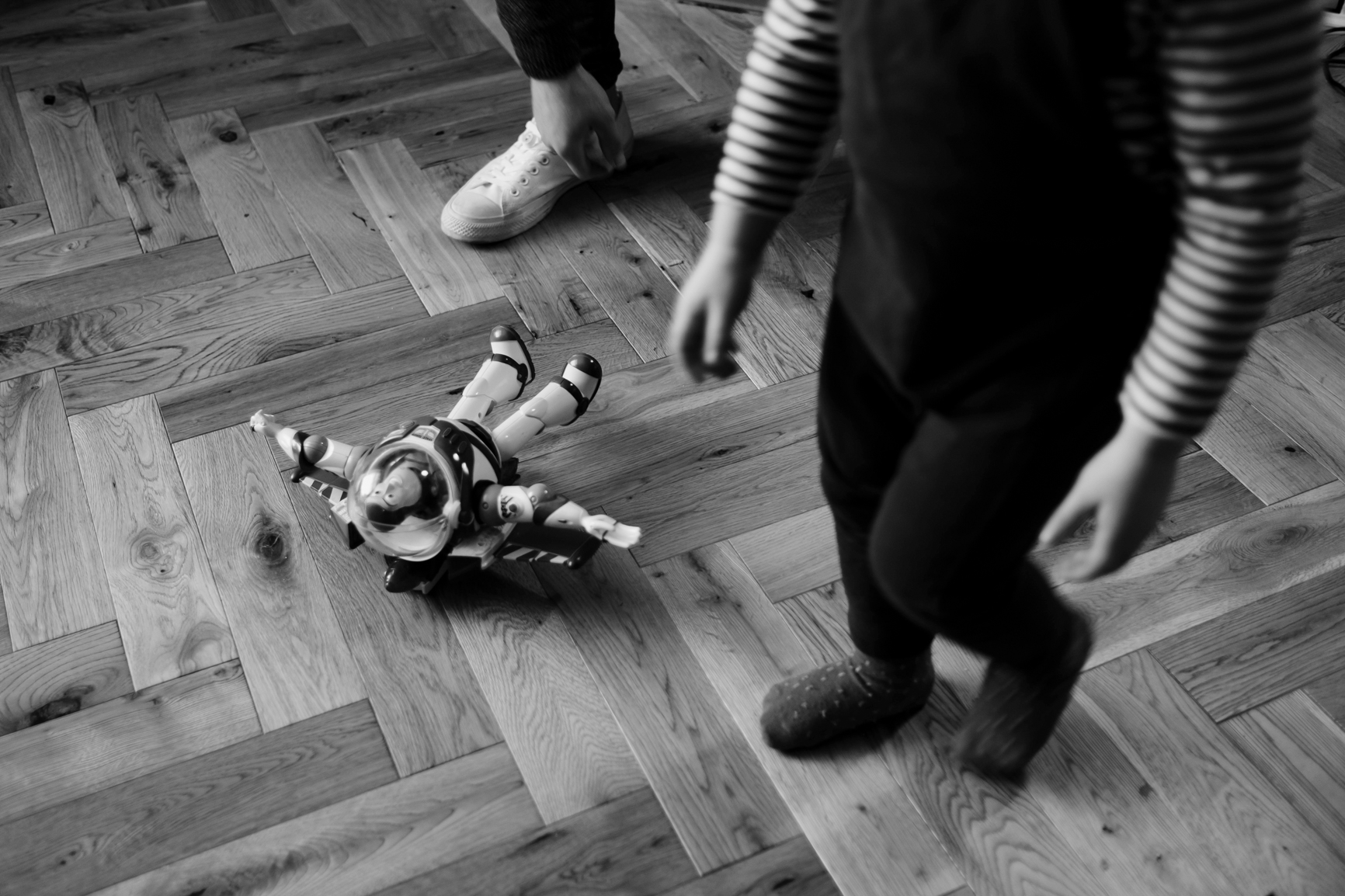  Child walks past toy on the floor. 