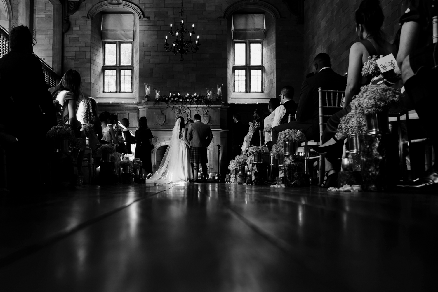  Bride+ groom standing at the top of the aisle in the Achnagairn Estate ballrom 