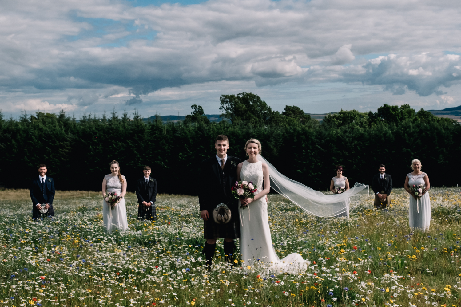 An unconventional line up of the wedding party.
