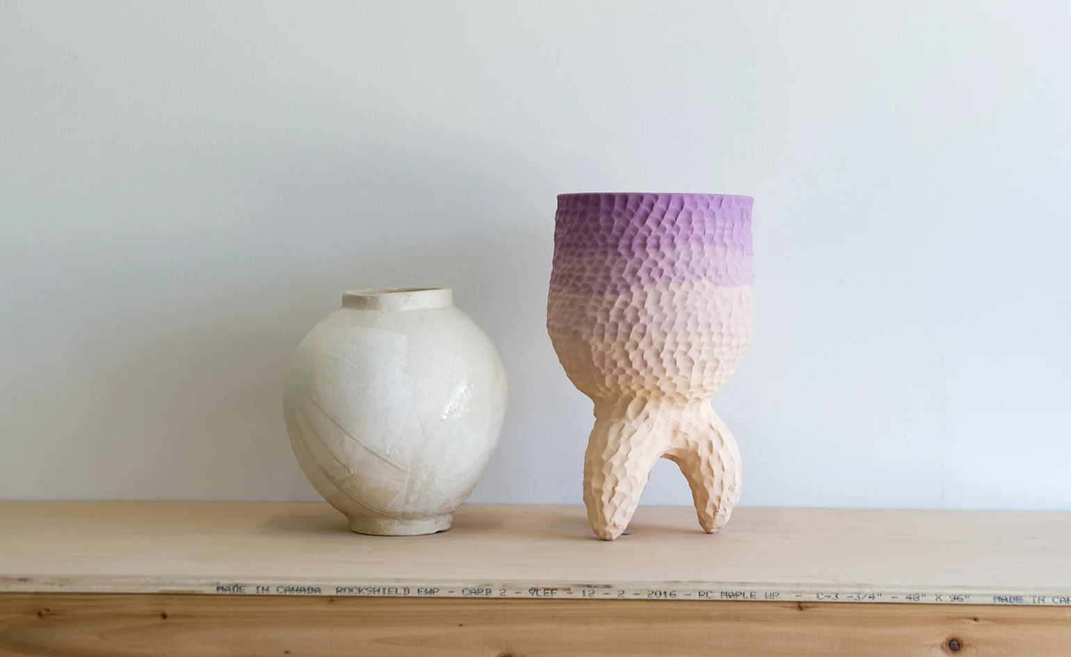 ‘I’ve always been interested in the use of craft materials in contemporary art. I feel that clay in particular is a dynamic material that is used to create everyday objects as well as fine art,’ Curtis explains. Pictured: a vessel by Romy Northover (left) and a standing vessel by Sean Gerstley (right) via WALLPAPER