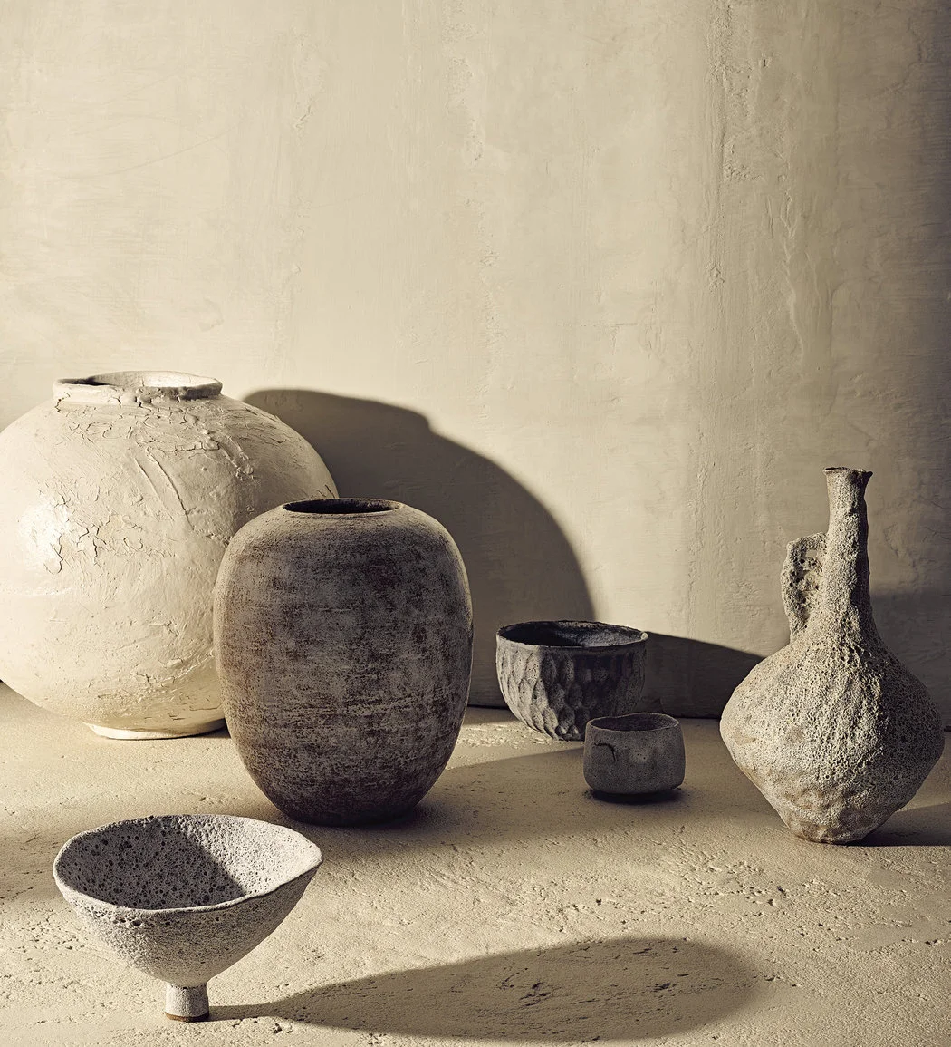 Clockwise from back left: No. vase with cracked Shino glaze, Dora Alzamora Good’s hand-thrown stoneware vase, a textured glaze cereal bowl by Akiko Hirai and a terracotta tea bowl, jug and ceremonial vessel from Alana Wilson.CreditPhotograph by Brooke Holm. Styled by Victoria Petro Conroy