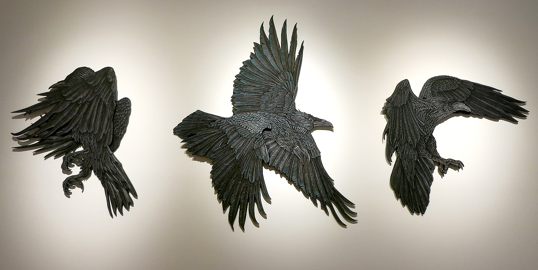 Rainbow Crow 1, 2 and 3 (2015 Woodcarvings and acrylic widest point 60" for scale)