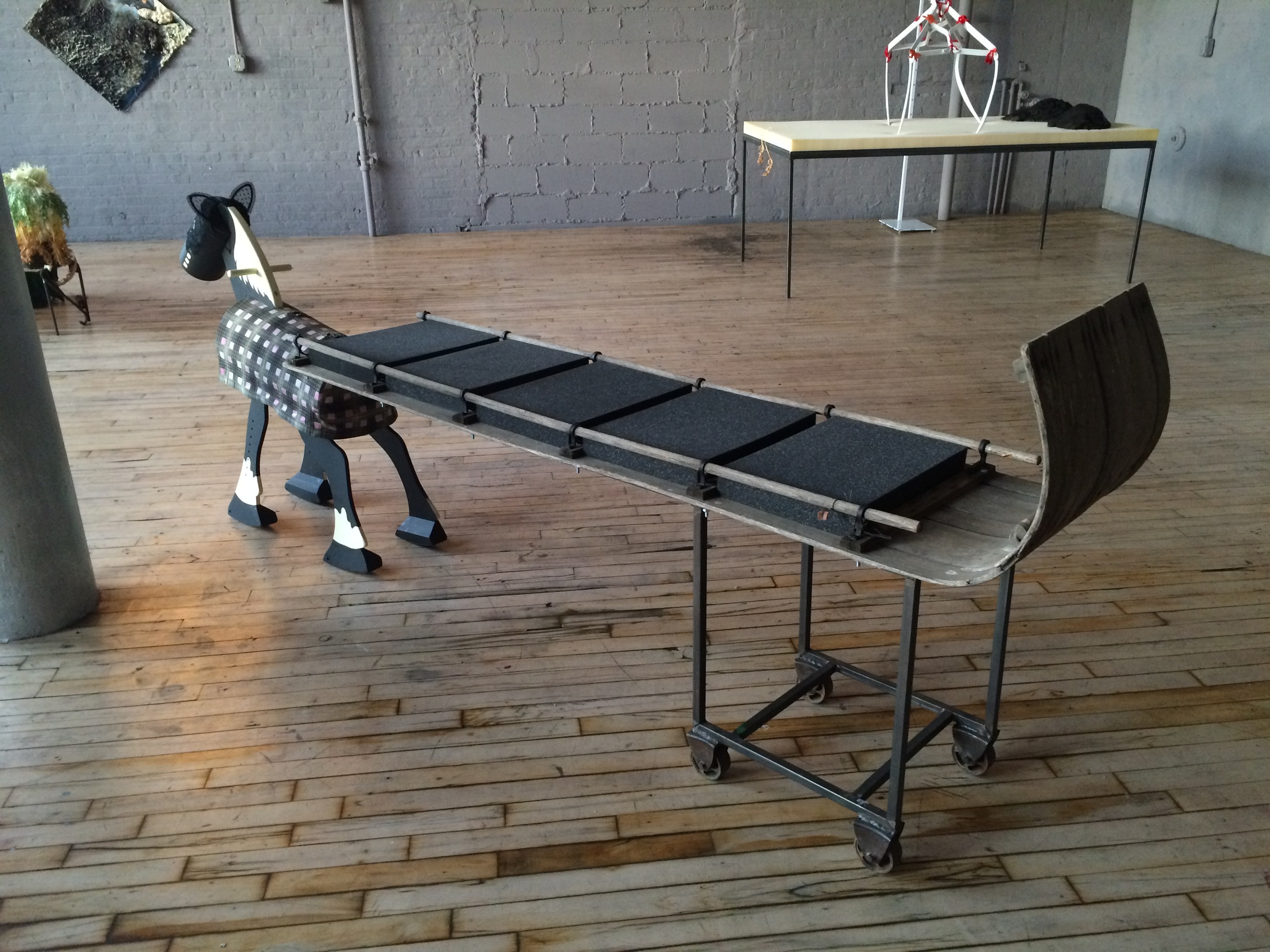   My Pony (Let's Do It) (Ride It)   foam, steel,&nbsp;tobaggon, wood, latex paint, lace  3' x 9' x 1.5'  2015 