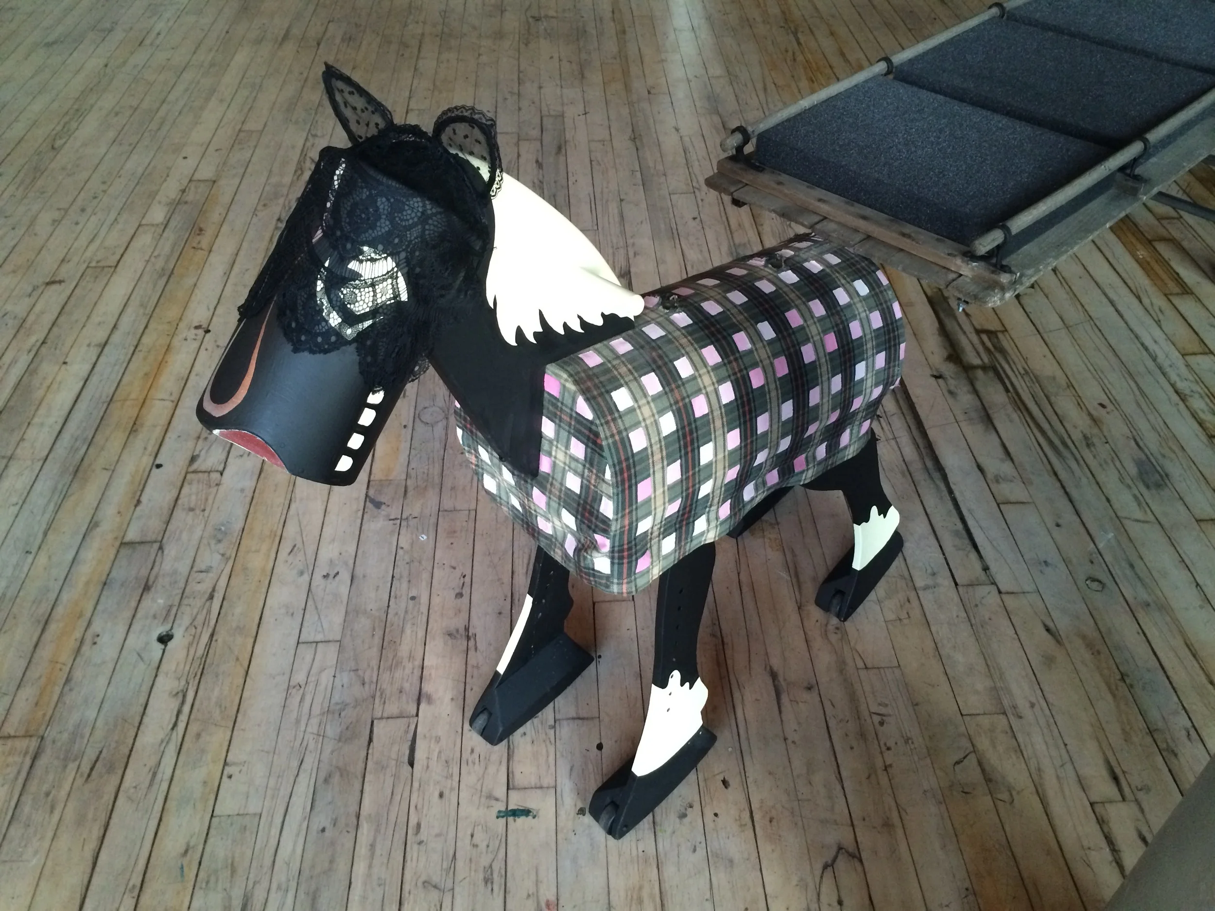   My Pony (Let's Do It) (Ride It)   foam, steel,&nbsp;tobaggon, wood, latex paint, lace  3' x 9' x 1.5'  2015    