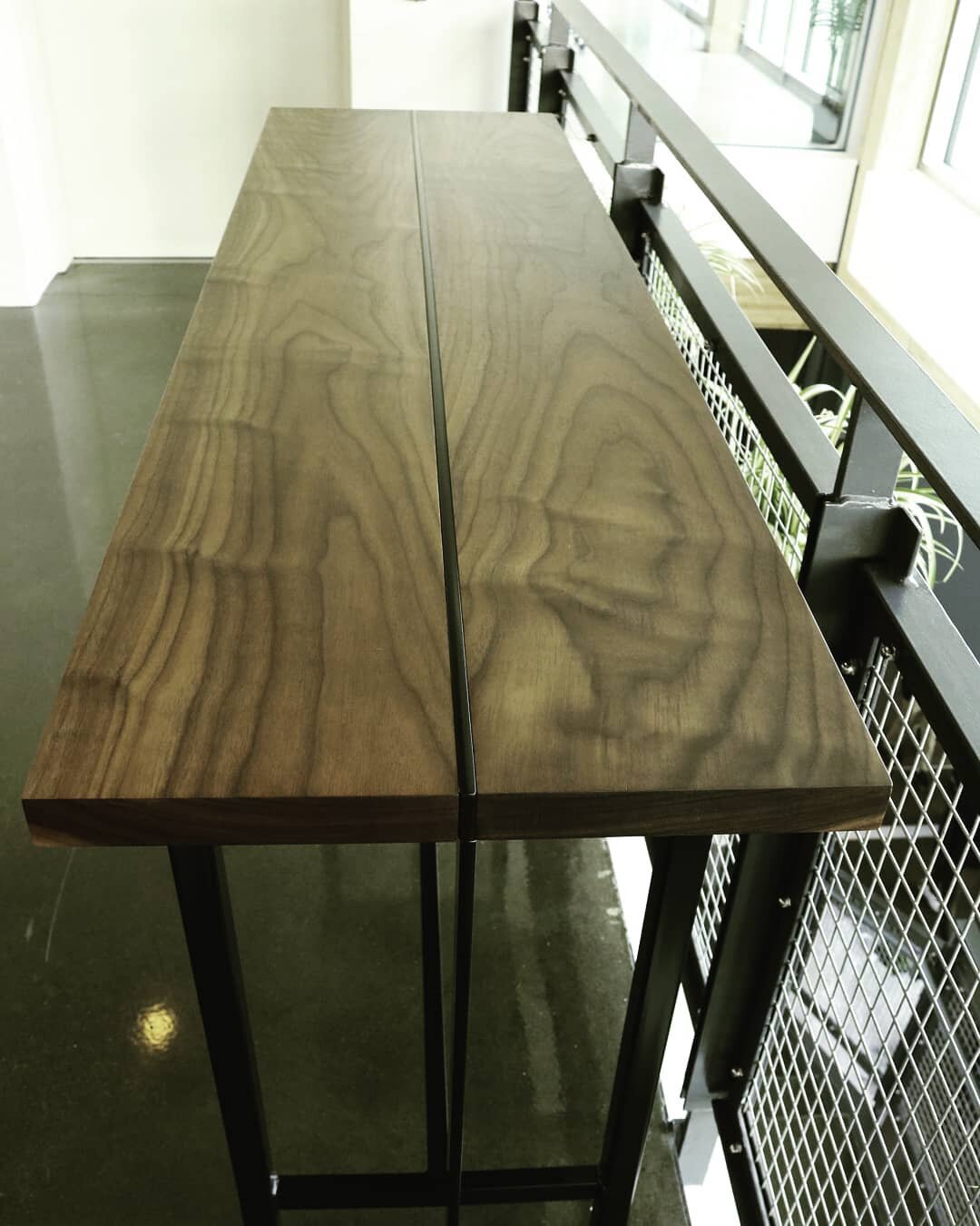 Tri leg console in walnut and matte black steel. #yycdesign #yyc #yyclifestyle #interiordesign #furnituredesign #console #furniture #table #design #walnutfurniture #walnut