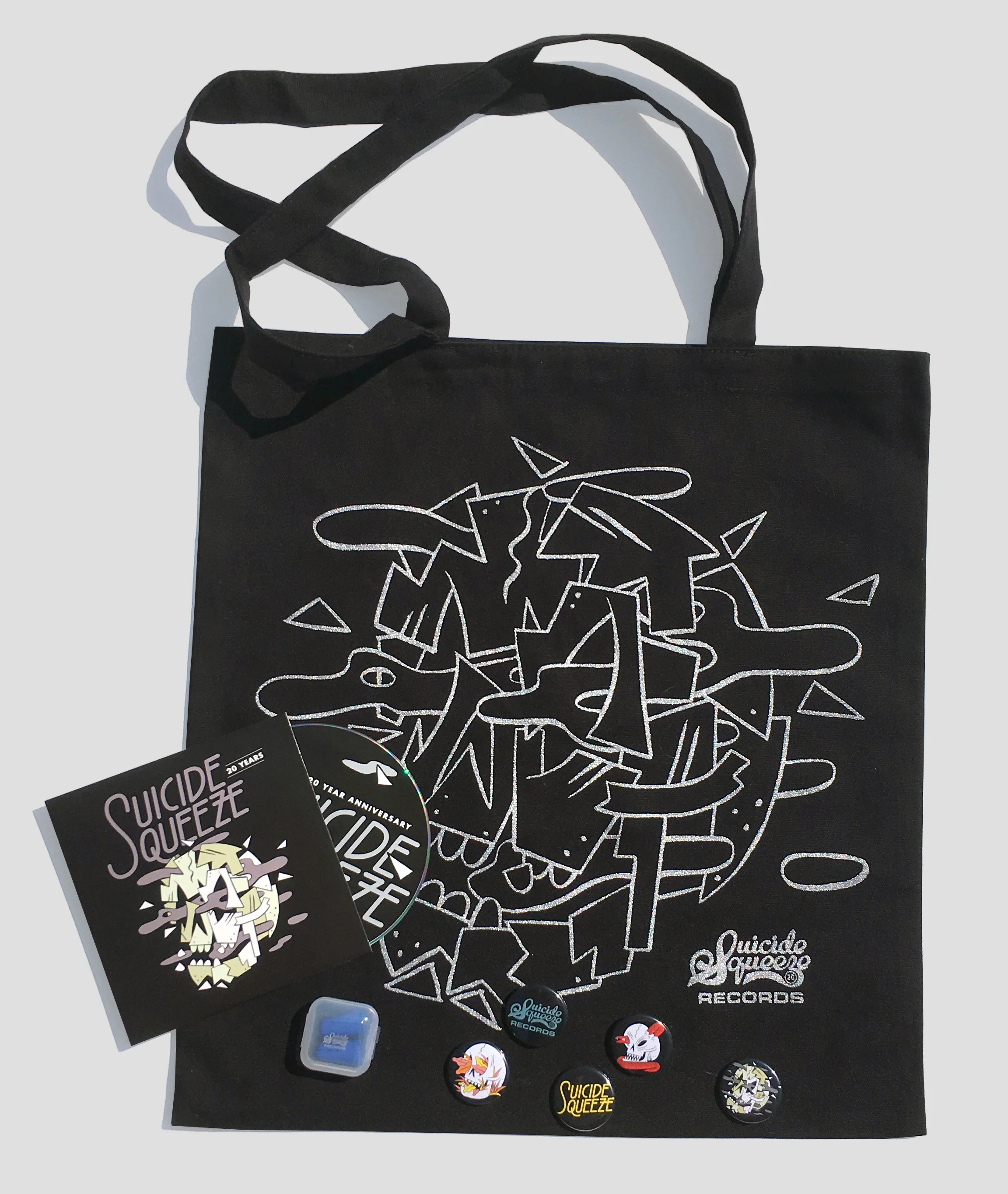 Giveaway to first attendees to both nights featuring a totebag, sampler CD, earplugs in Suicide Squeeze case, and pinback buttons