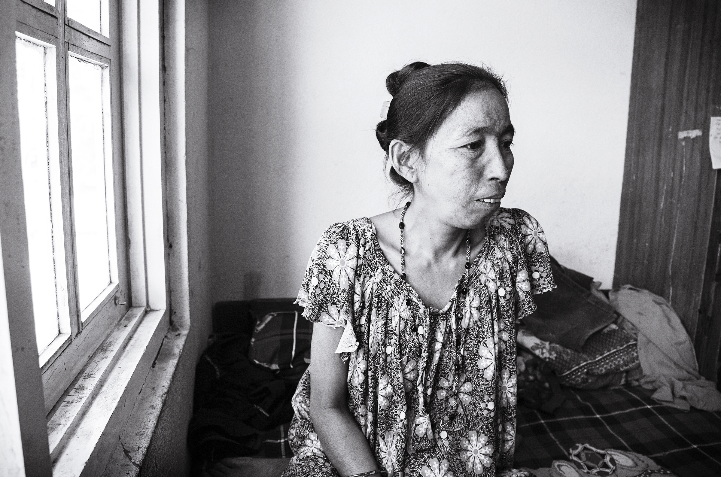Phoolmaya spends much of her time inside of the family's room. Her level of activity is limited, as her knee, which she did not receive medical treatment for, continues to heal after being crushed in the earthquake. 