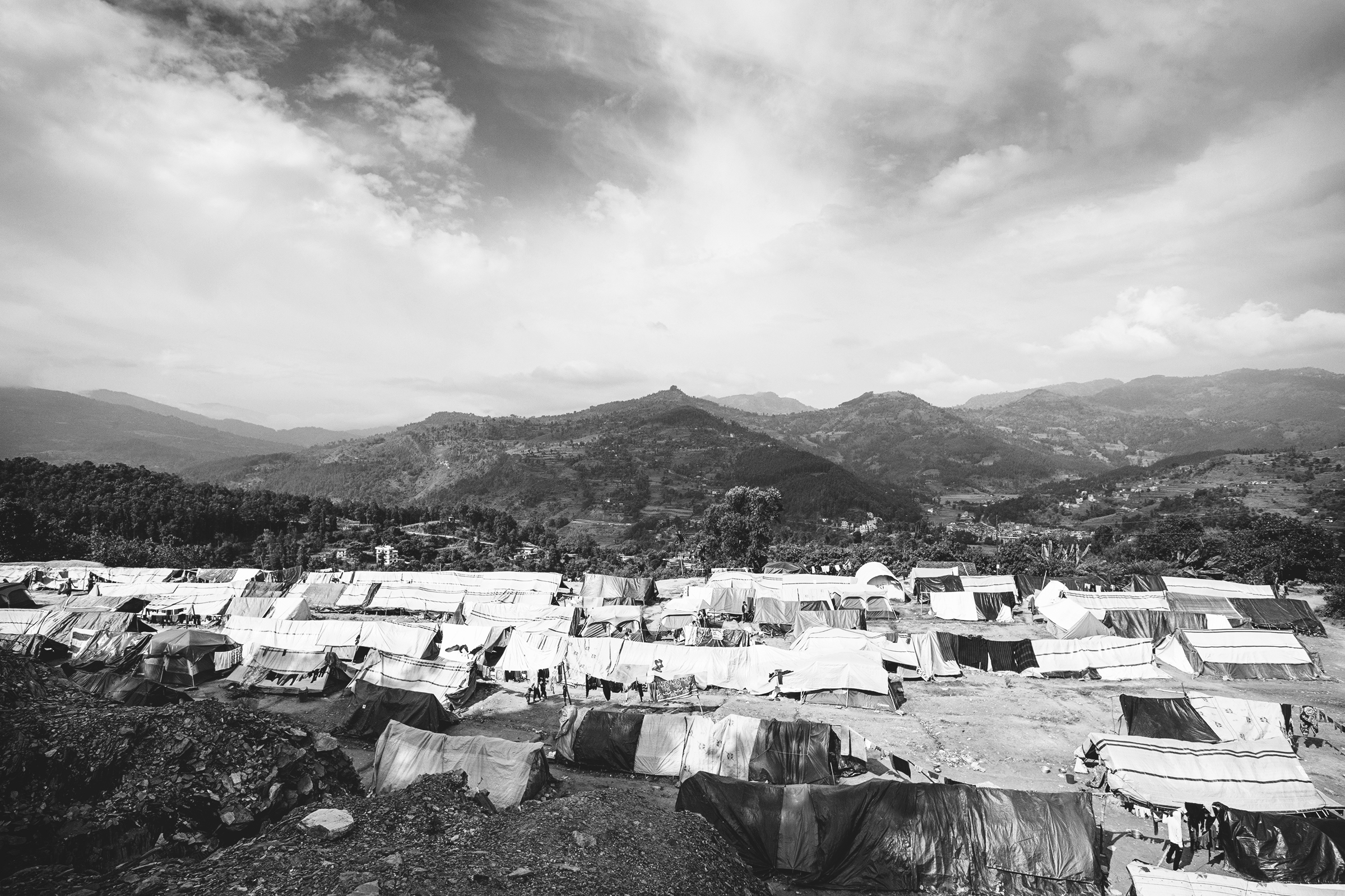  An estimated 2.8 million people were displaced following the 7.8 magnitude April 2015 earthquake in Nepal. With over 500,000 homes destroyed, affected families have been living temporarily in displacement camps since.&nbsp;  Alchi Danda camp in Nepa