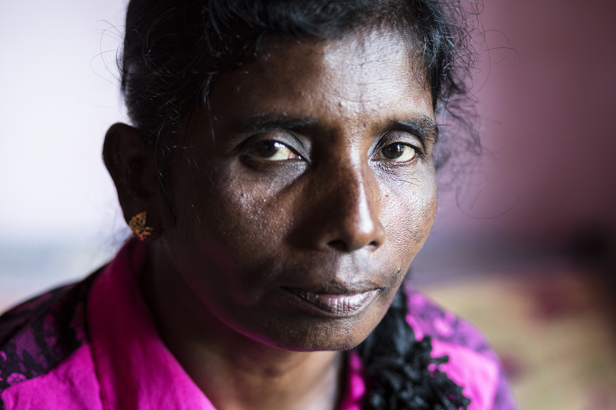  Mary, 46.&nbsp; Mary has three sons, all of whom have been imprisoned or held within the LTTE army camps. She recounts her own time spent in a displacement camp after being taken by the army.  "I remember the mango trees. We were the first ones the 